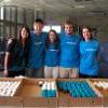 SGA students and coordinator with cupcakes.